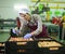 Hired farm worker checks and sorts peaches in warehouse