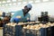 Hired food warehouse worker checks quality of the harvested potato crop