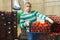 Hired latino worker carries boxes of tomatoes in the backyard