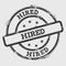 Hired rubber stamp on white background.