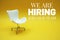 We are Hiring and Join Our Team and empty chair business concept background