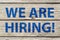 We are hiring written on wood background, recruitment concept