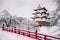 Hirosaki Castle and its red wooden bridge in winter season, Aomori, Tohoku, Japan