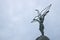 Hiroshima Childrens Peace Monument statue showing a girl with a origami crane on dark sky, Hiroshima, Japan