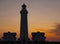 Hirtshals lighthouse at sunset on the coast.