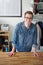 His career is trending. Portrait of a smiling young male designer standing at her desk in an office.