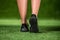 His feet beautiful woman in the shoes on a grass