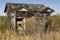 His and hers outhouse prairie grass building bathroom