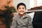 His little smile brightens up the whole room. Portrait of an adorable little boy relaxing on the sofa at home.