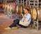 This is his sanctuary. A mature wine maker tasting a glass of red wine while in his cellar.