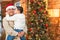 Hispanic Armed Forces Soldier Wearing Santa Hat Hugging Son