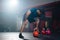 Hispanic athlete lifting kettlebell training for maintain muscle in fitness gym