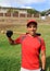 Hispanic baseball player in the field smiling