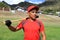 Hispanic baseball player in the field smiling