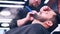 hispanic bearded man having his hair cut by hairdresser at the barbershop