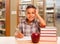 Hispanic Boy with Books, Apple, Pencil and Paper at Library
