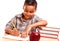 Hispanic Boy Writing with Books, Apple