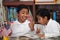 Hispanic Boys in Home-school Setting Having Fun with Books