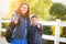 Hispanic Brother and Sister Wearing Backpacks Give a Thumbs Up