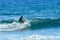 Hispanic Brunette Man With Pigtail Catching Waves On Las Americas Beach. April 11, 2019. Santa Cruz De Tenerife Spain Africa.