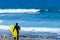 Hispanic Brunette Woman With Pigtail Prepared For Surfing On Las Americas Beach. April 11, 2019. Santa Cruz De Tenerife Spain