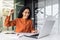 Hispanic business woman celebrating victory success, employee with curly hair inside office reading good news, using