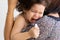 Hispanic children cry when displeased. Parents comfort the crying baby