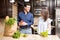 Hispanic couple emptying the grocery bag in kitchen