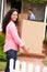 Hispanic couple moving into new home