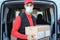 Hispanic delivery man wearing safety mask for coronavirus prevention - Focus on face