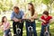 Hispanic family on bikes in park