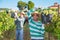 Hispanic farm worker loading freshly picked grapes in truck