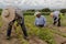 hispanic farmers manual amaranthus planting in a Mexico's farming field