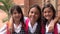 Hispanic Girl Students And Friendship Wearing School Uniforms