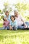 Hispanic Grandmother And Grandfather Relaxing With Grandchildren