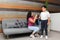 Hispanic Latino mom and son prepare for back to school in uniform and backpack say goodbye in the morning