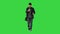 Hispanic mailman walking and using his phone looking for the right address on a Green Screen, Chroma Key.