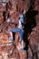 Hispanic male climber reaching into his chalk bag