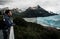 Hispanic male stands overlooking a tranquil lake surrounded by the majestic Perito Moreno glacier