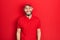 Hispanic man with beard wearing delivery uniform and cap with a happy and cool smile on face