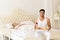 Hispanic Man Bring Breakfast To Sleeping Woman In Morning Tray With Red Rose Flower, Young Couple