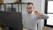 Hispanic man business worker stretching at office