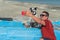 Hispanic Man taking a selfie with his dog on the beach in summertime