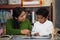 Hispanic Mom and Boy in Home-school Setting Studying Rocks