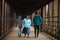 Hispanic Mother Walks With Sons On A Bridge