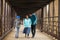 Hispanic Mother Walks With Sons On A Bridge
