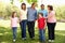 Hispanic Mulit generation family walking in park