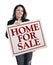 Hispanic Realtor Holding Home For Sale Real Estate Sign