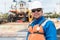 Hispanic sea going marine deck officer, with PPE personal protective equipment - hull, covered