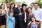 Hispanic Student And Family Celebrating Graduation